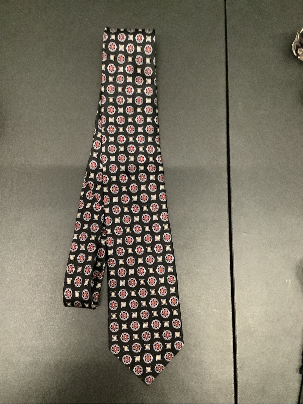 Men's Black Silk Tie with Red and White Medallion Pattern